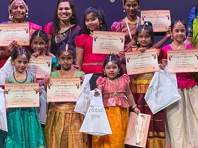 Students celebrating after receiving certificates